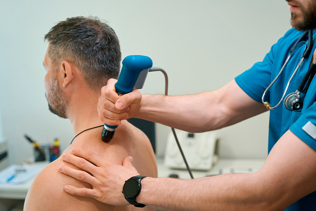 A man undergoing a machine therapy in a fitness center, highlighting the importance of MyACT technology for health monitoring.