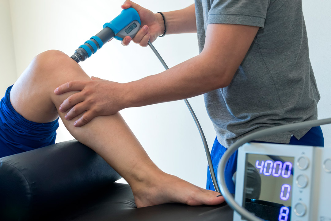 A man receive a leg treatment, highlighting the advantages of MyACT technology for fitness centers.