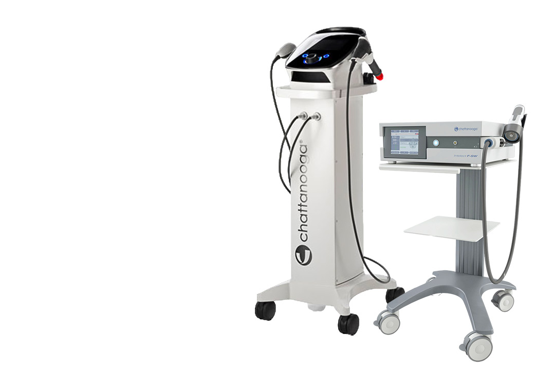 A close-up of a medical device next to a shockwave therapy machine, highlighting choices for therapy equipment rental.