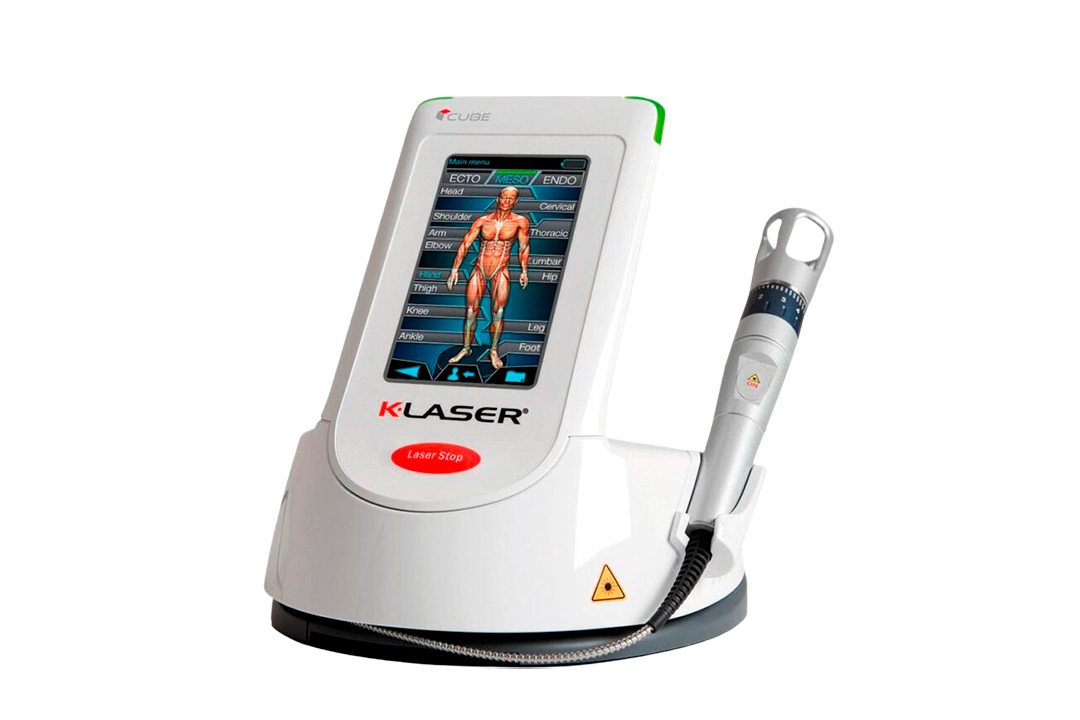 A person undergoing shockwave therapy on a medical device designed for treatment.